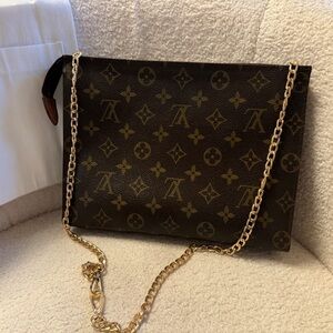 Authentic Louis Vuitton Toiletry Pouch with free Generic Chain